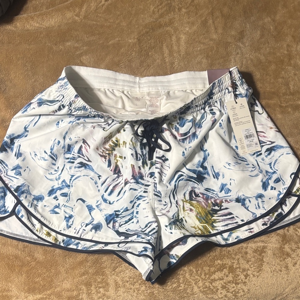 Calla White Athletic Shorts with colorful abstract print